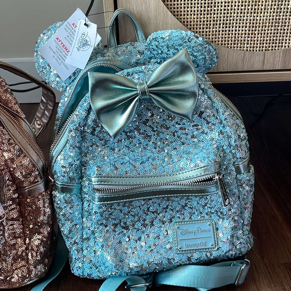 Disney parks lounge fly baby blue sequins backpack new with tags.